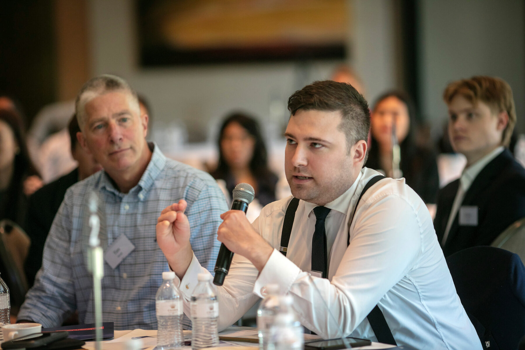 A participant speaking during a forum discussion
